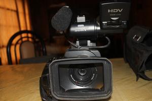 Camara Sony HD + funda + bolso + cargador portatil +acc.