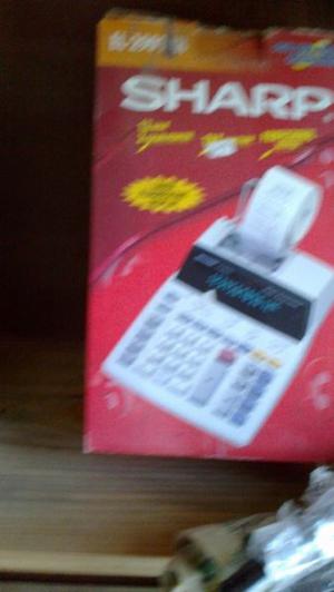 calculadora sharp,en caja con rollo poco uso
