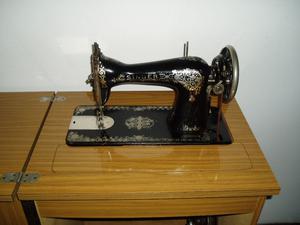 Máquina de coser Singer con mueble. Impecable.