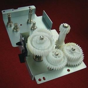 Fuser drive side plate and gear assembly