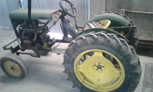 Vendo o Permuto Mini tractor.con cotadora de pasto de