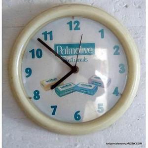 reloj a pila publicitario de palmolive de 24 cm de diametro