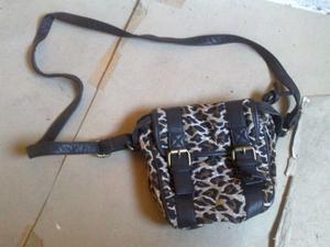 carterita bandolera animal print. liquido