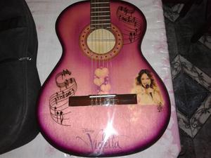 vendo guitarra nueva de violeta con funda.