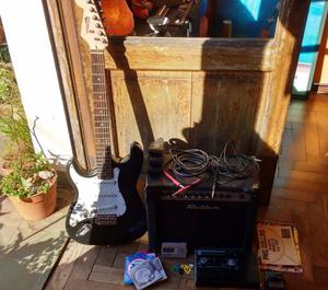 Guitarra + amplificador + pedalera + cables + +