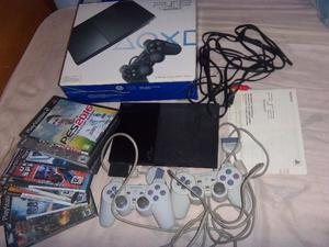 Playstation 2, slim en caja, 2 joysticks, memoria y juegos