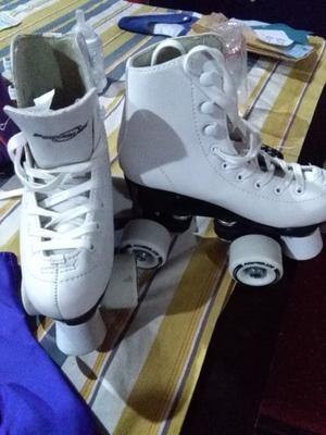 vendo patines sin uso n32 con cubre patin y bolso