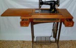 maquina de coser singer antigua con pie de hierro