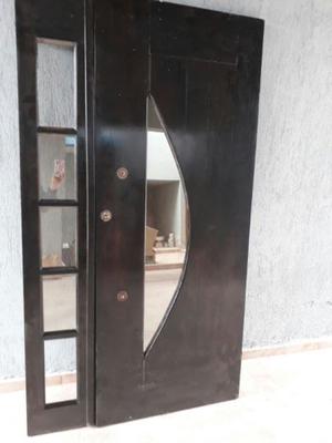 Puerta guatambu con vidrio espejado