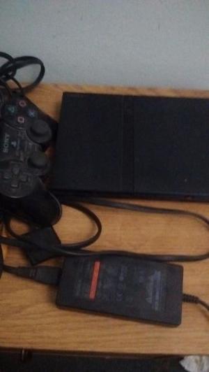 Playstation2 con caja de juegos