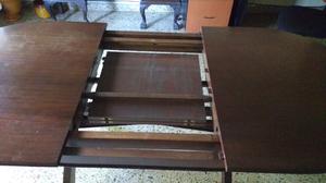 Mesa comedor ovalada extensible en madera de cedro con tapa