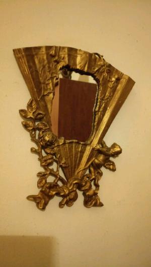 Antiguo espejo de bronce macizo con forma de abanico con