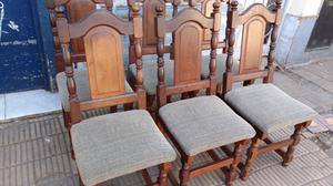 Antiguas sillas de estilo en algarrobo tapizadas