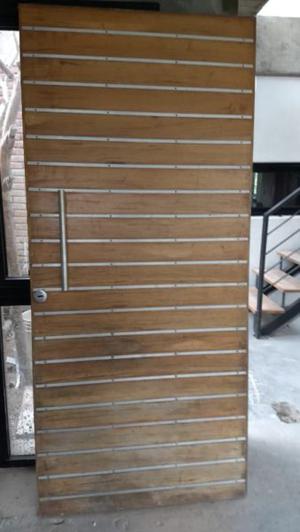 Vendo puerta de madera pivotante (cedro macizo)