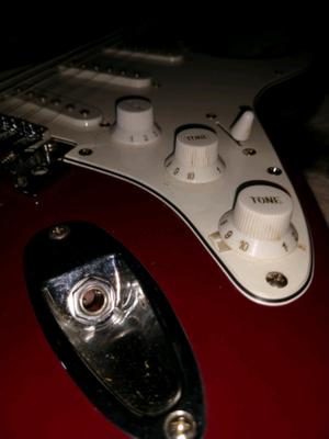 Guitarra eléctrica con amplificador
