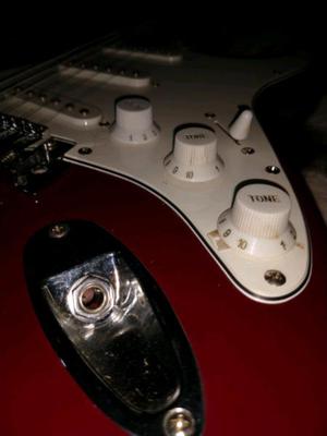 Guitarra eléctrica con amplificador