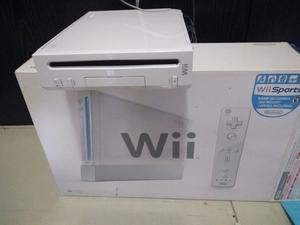 Wii completa, casi sin uso, en caja y con juegos