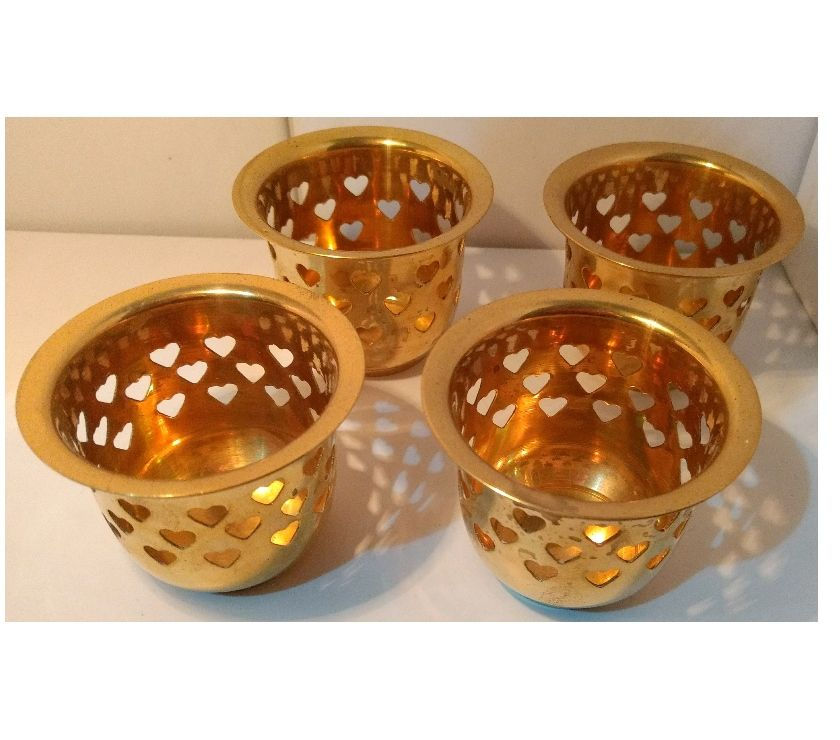 4 porta velas de bronce