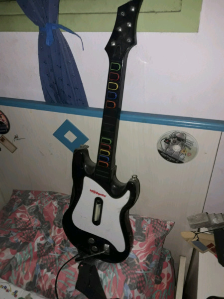 Guitarra para play2 y un juego