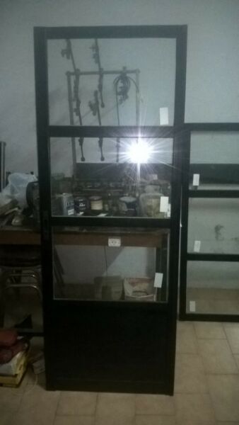 vendo puerta balcon negra corrediza.1,5 x 2 m. linea herrero