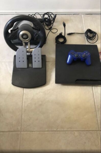 Play station 3 en perfecto estado con 7 juegos y un volante