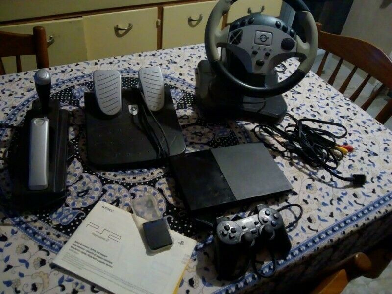 Playstation 2 con Volante y 4 juegos