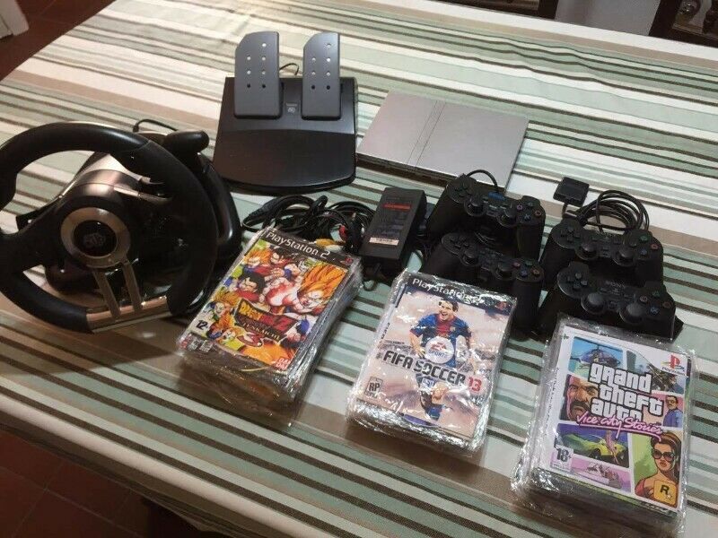 PLAY STATION 2 + JOYSTICKS + JUEGOS + VOLANTE