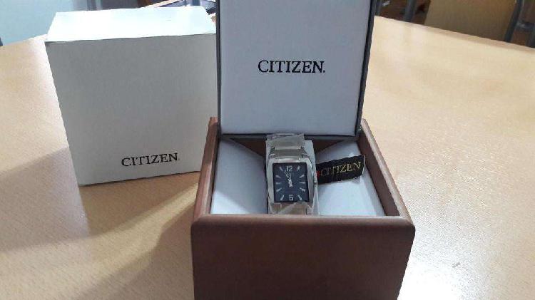 Reloj Citizen hombre fondo azul.-