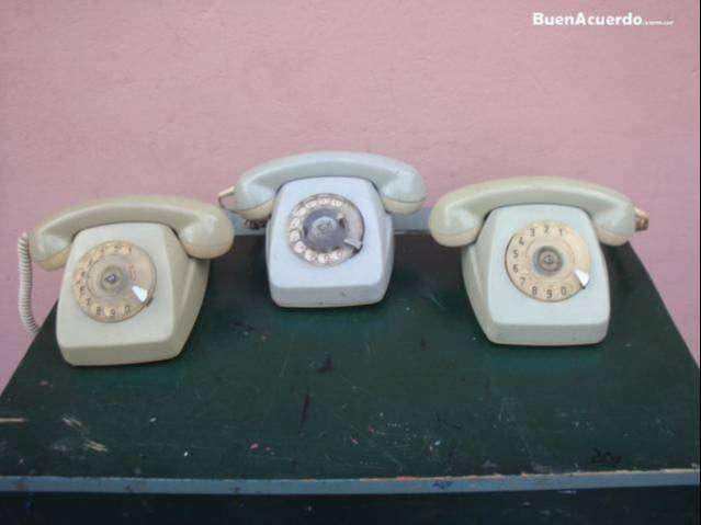 telefono gris a disco antiguo